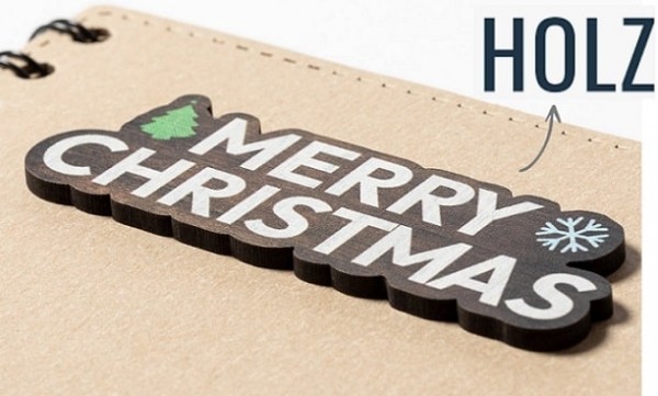 Vorderseite des Buchs mit Weihnachtsmotiv aus Holz